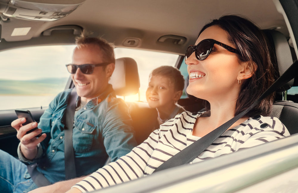Classic Vehicle Transport Protecting Your Vintage Ride - Happy family riding in a car